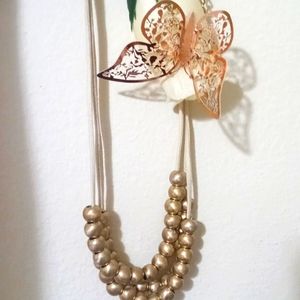 Cream and gold necklace